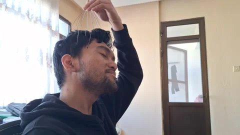 Man Using Scalp Head Massager Stock Footage 330759902