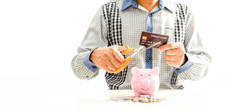 Man using scissors to cut credit card. Concept money, saving, Financial Stock Photos