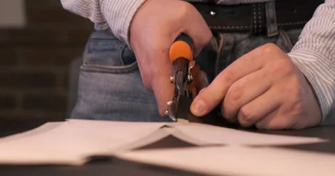 Man Using Scissors Cutting Leather Sketch, Production of Designer Clothes Stock Footage 133004903