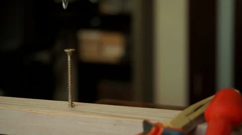 Man using screwdriver on wooden plate Stock Footage 61543978