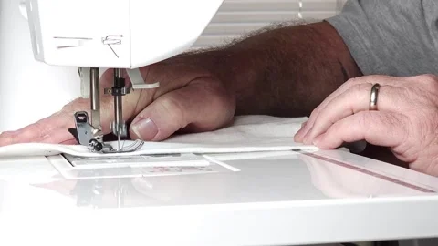Man using sewing machine Stock Footage 249698264