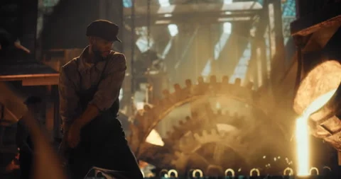 Man Using Sledgehammer in an Old Foundry Stock Footage 320868981