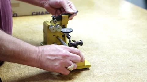 Man using small yellow machine Stock Footage 66767082