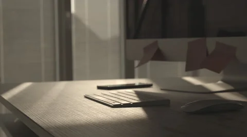 Man using smart mobile phone and typing on computer keyboard Stock Footage 63613903