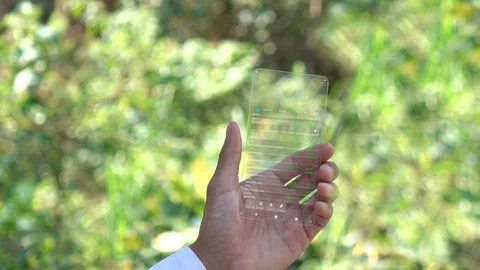 A man using smart phone for analyze stock market.hologram graph stock with futur Stock Footage 101319567