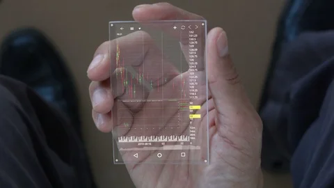 A man using smart phone for analyze stock market. Stock Footage 103189675