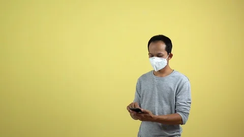 A man using a smart phone for checking an air toxic in real time. Stock Footage 123778745