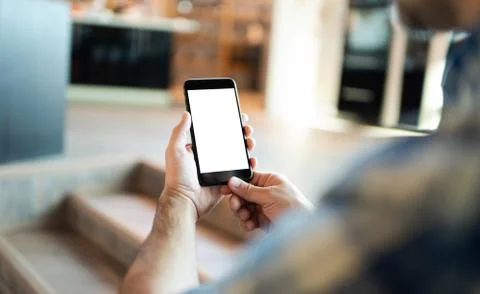 Man is using smart phone. Clipping path included. Fotos de archivo