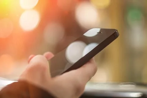 Man using smart phone close up. Mobile phone in male hand Stock Photos