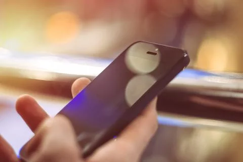 Man using smart phone close up. Mobile phone in hand Stock Photos