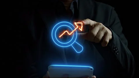 Man using smart phone with glowing neon line magnifying glass and up fire arrow Stock Footage 249865940