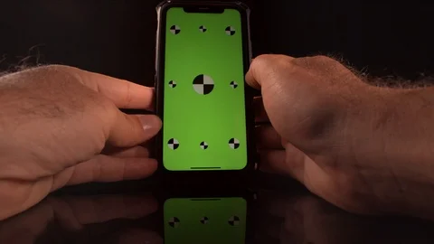 Man using a smart phone with green screen and tracking markers Stock-Footage 125290208
