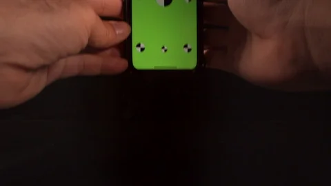Man using a smart phone with green screen and tracking markers Stock-Footage 125290225
