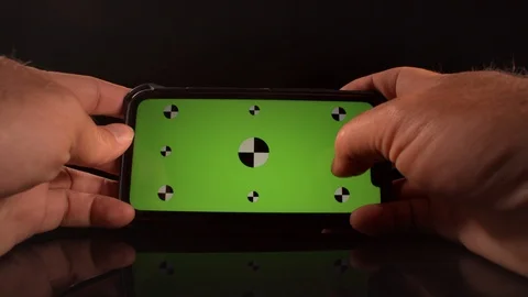 Man using a smart phone with green screen and tracking markers Stock-Footage 125290268