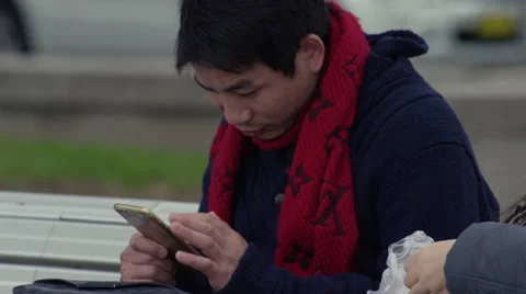 Man using smart phone outside Stock Footage 67669019