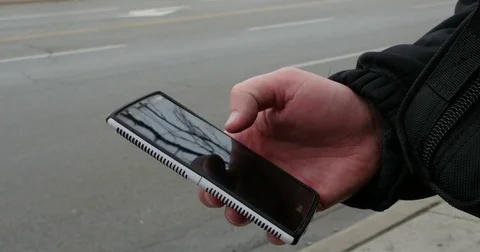 Man Using Smart Phone on Street Corner in City Close up on Hand, 4K Stock Footage 73500380