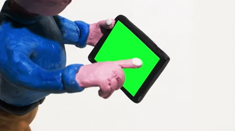 Man Using Smart Phone Tablet with Green Screen Clay Animation Isolated on White Stock Footage 58137884