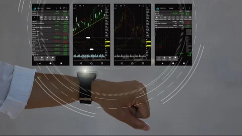 A man using smart  watch for analyze stock market.hologram graph stock with futu Stock Footage 100576196