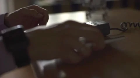Man using smart watch to express pay on a wooden table Stock Footage 66882916