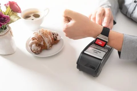 Man using smart watch to pay in restaurant 스톡 사진