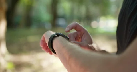 Man Using Smart Watch Wearable Wristband Device. Close Up Touch Screen Wearable Stock Footage 194460217