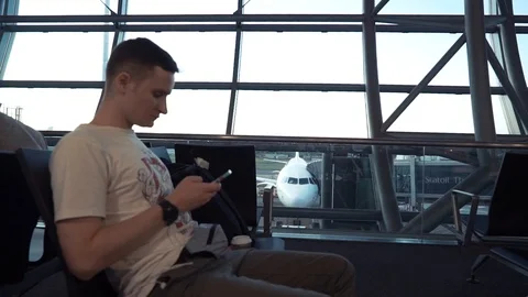 Man using smartphone in the airport Video stock 87247753