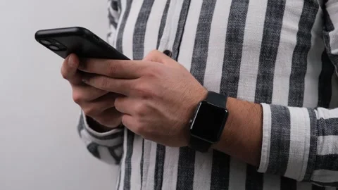 Man using smartphone and smartwatch Stock Footage 259653936