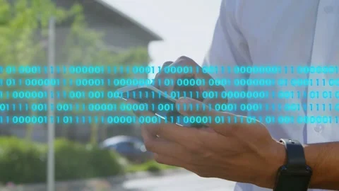 Man using smartphone and swiping, initiating cyan binary stream filling road, 動画素材 333553173