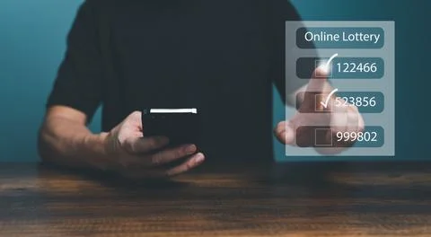 Man using smartphone and touching on virtual Online lottery screen to buy two Stock Photos