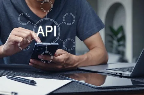 Man Using Smartphone with API Interface Concept Overlaid Stock Photos