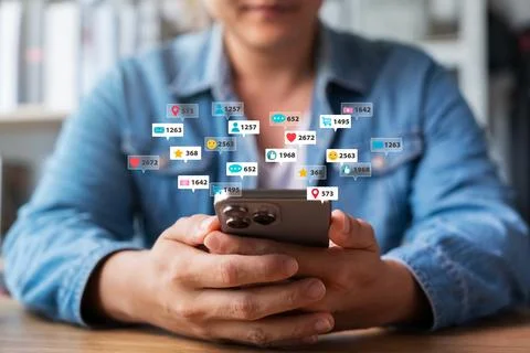 Man using smartphone application accessing social media networks, displayin.. Stock Photos