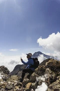 Man using smartphone application navigation in mountains travel. Stock-Fotos