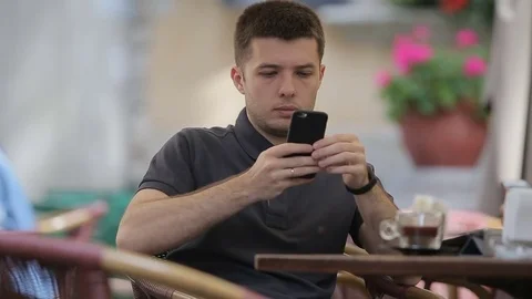 Man using Smartphone in Cafe. Stock Footage 76835430