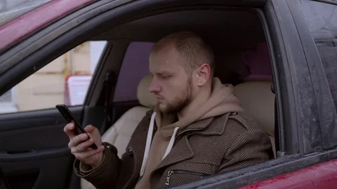 Man using smartphone in car Stock Footage 101705846