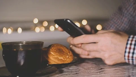 Man using smartphone in coffee shop. Stock Footage 81869091