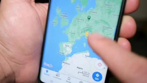 Man using smartphone google maps app for travel location search,gps Stock Footage 143744263