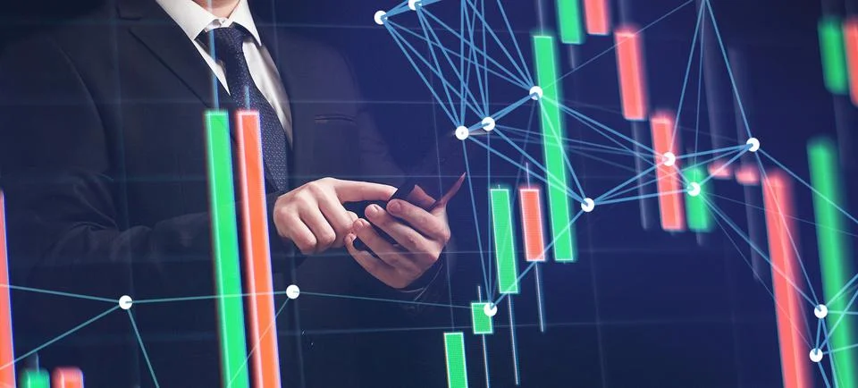 Man using smartphone with graphs analysis candle line and foreign currency ra Stock Photos