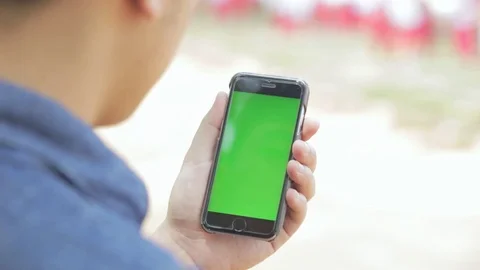 Man using smartphone with green screen Stock Footage 80104081