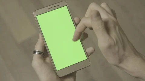 Man using smartphone with green screen. Close up shot hands with mobile Stock Footage 89533160