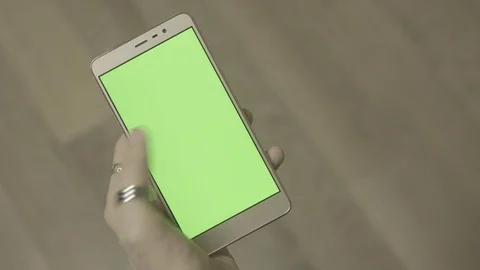 Man using smartphone with green screen. Close up shot hands with mobile Stock Footage 89533250
