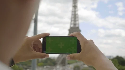 Man using smartphone with Green Screen at Eiffel Tower, in Horizontal Landscape Stock Footage 111926433
