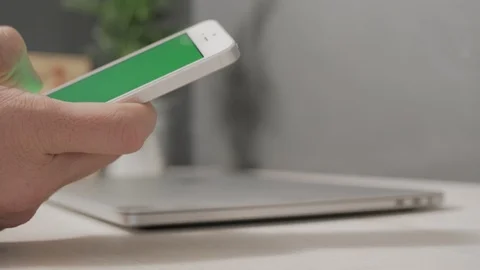 Man using smartphone with a green screen Stock Footage 120594832