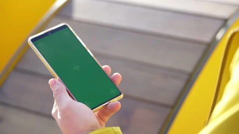 Man using smartphone green screen browsing online outside. Mock up for watching Stock Footage 169391569