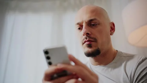 Man Using Smartphone at Home Stock Footage 297991405