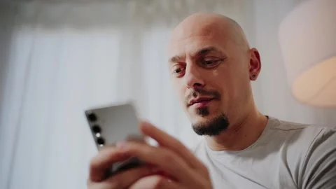 Man Using Smartphone at Home Stock Footage 297991632