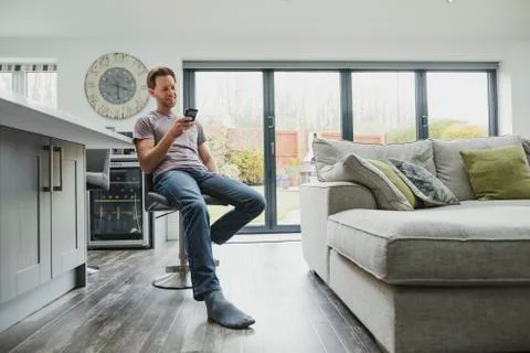 Man Using Smartphone At Home Stock Photos
