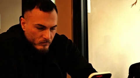 Man using smartphone indoors Stock Footage 317848931