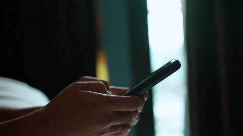 Man using smartphone in the living room at home, Hand typing message 스톡 동영상 140249493