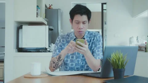 Man Using Smartphone in Modern Kitchen Video stock 314594186