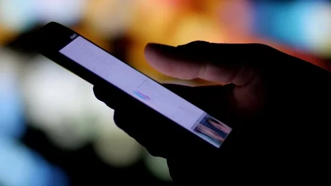 Man using smartphone at night in the city. Stock Footage 71806688